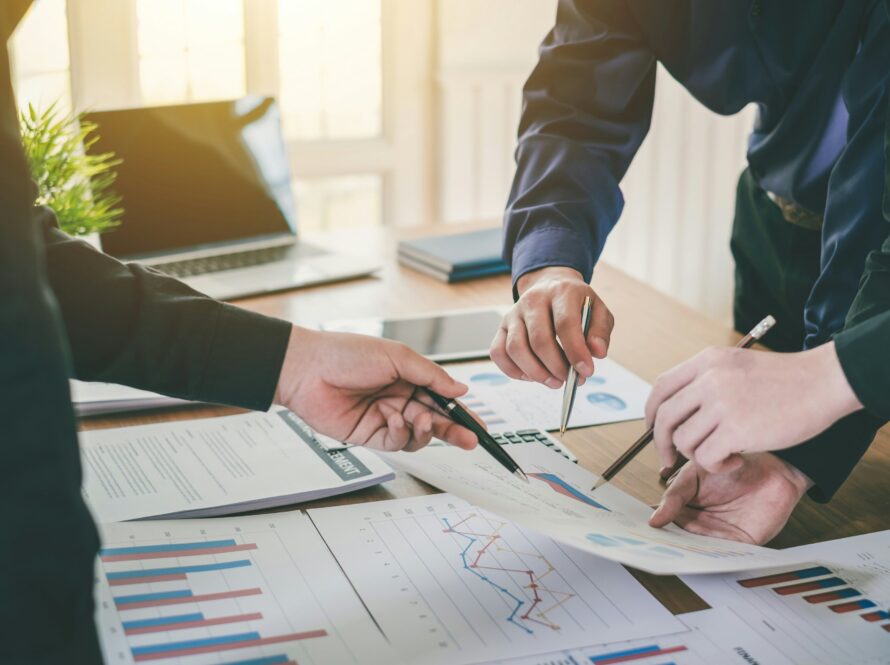 Business owner analyzing financial growth charts before selling a company
