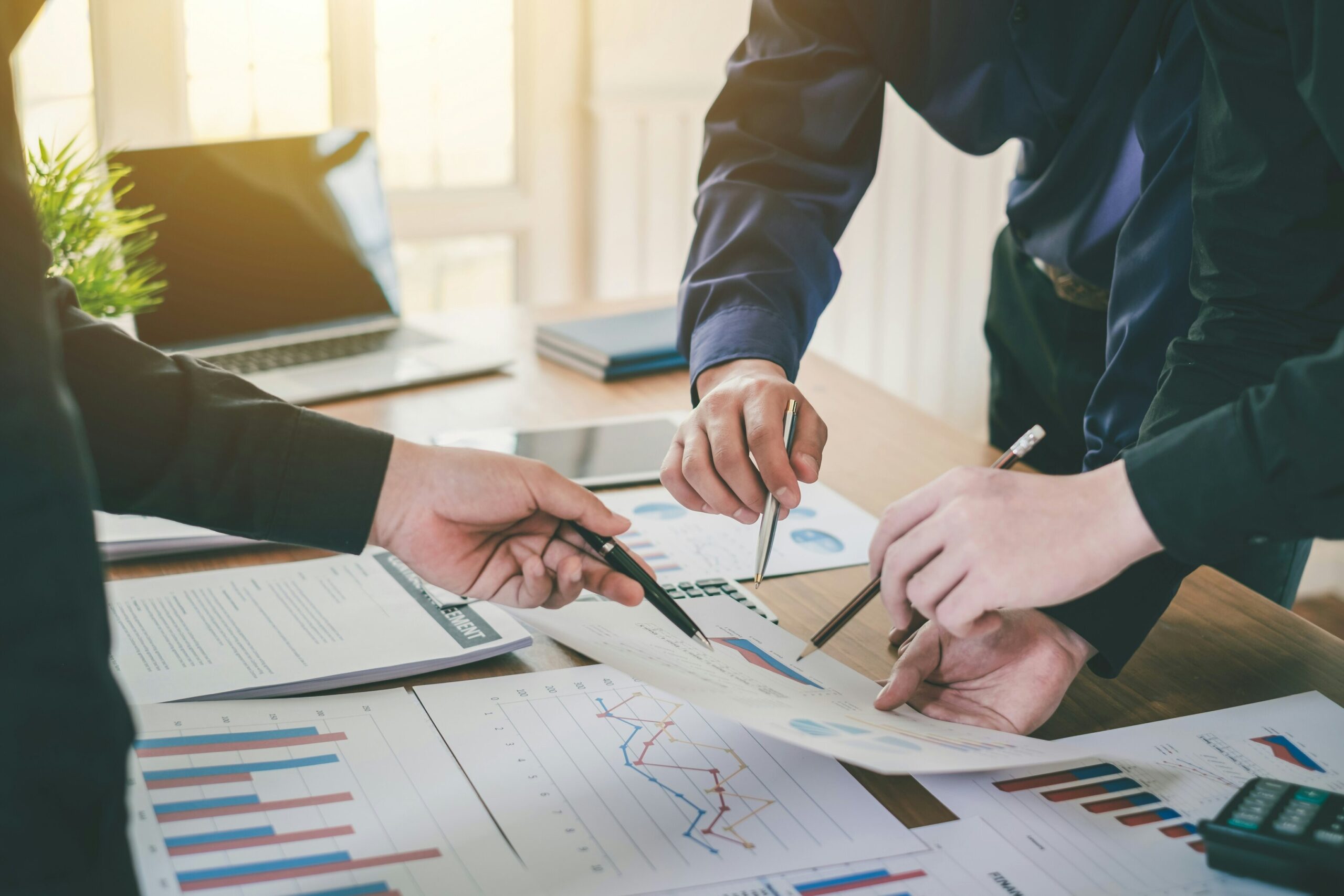 Business owner analyzing financial growth charts before selling a company